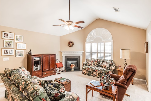 carpeted living room featuring lofted ceiling and ceiling fan