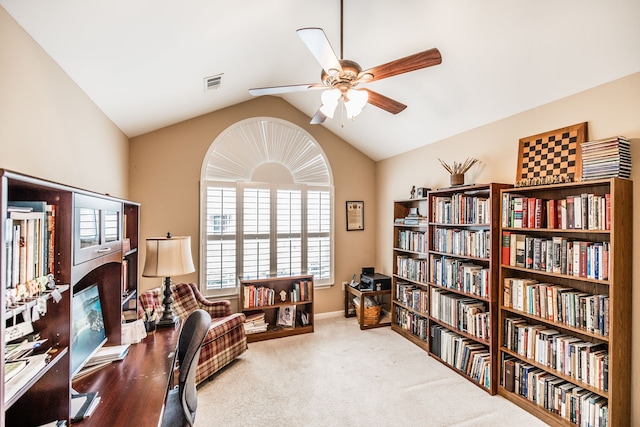 living area featuring lofted ceiling, carpet flooring, and ceiling fan