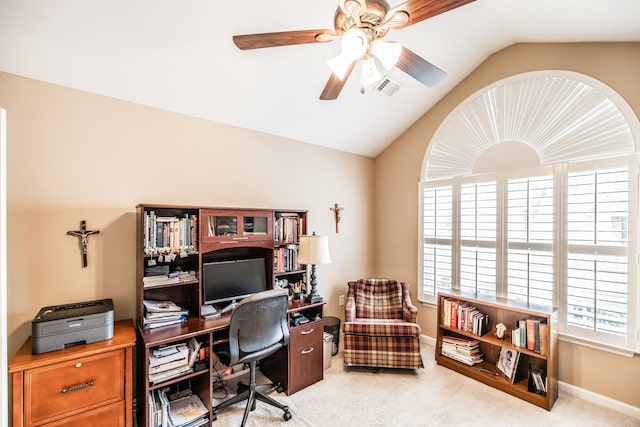 office space featuring light colored carpet, lofted ceiling, and ceiling fan