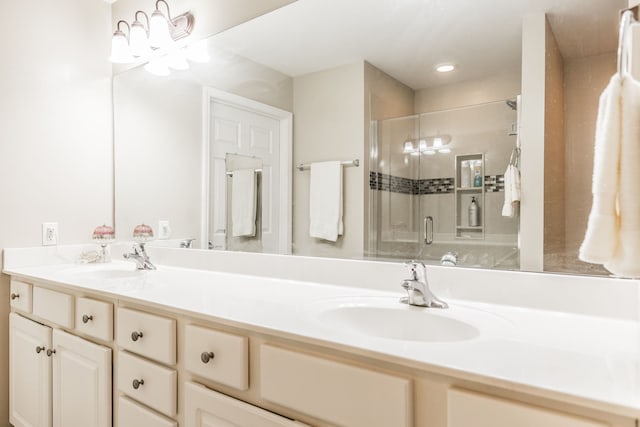 bathroom with an enclosed shower and vanity