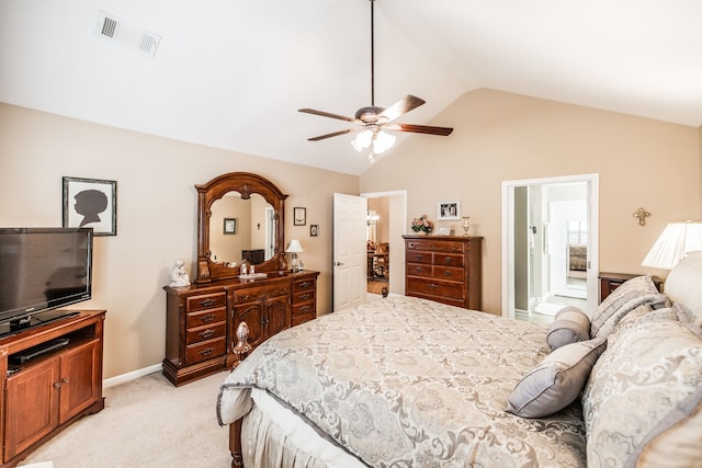 bedroom featuring high vaulted ceiling, light colored carpet, ceiling fan, and ensuite bath