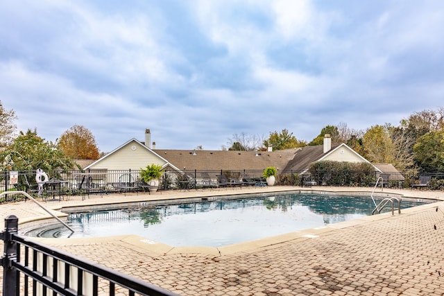 view of swimming pool with a patio area