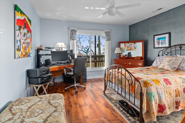 bedroom with hardwood / wood-style floors and ceiling fan