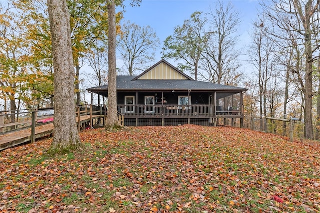 back of property with a sunroom