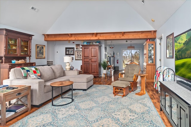 living room featuring high vaulted ceiling and wood-type flooring