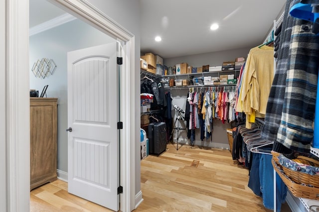 spacious closet featuring hardwood / wood-style floors