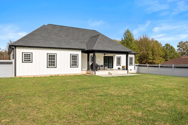 back of house with a patio area, a yard, and ceiling fan