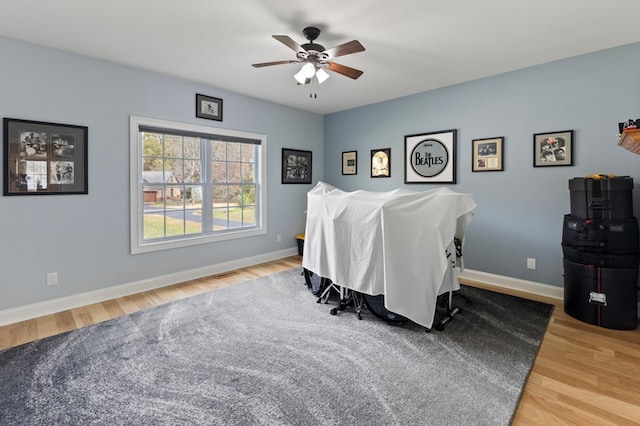 bedroom featuring hardwood / wood-style floors and ceiling fan