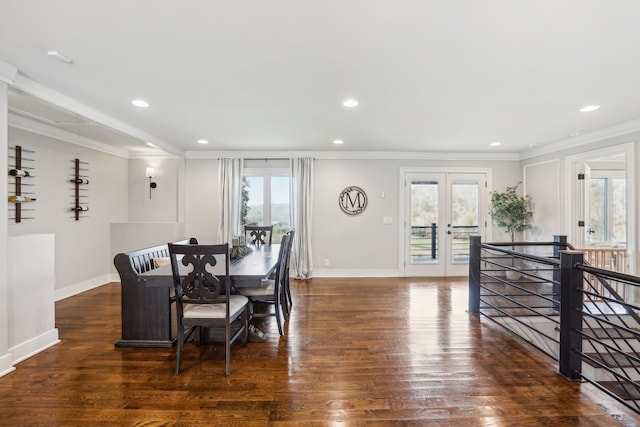 dining space featuring french doors, crown molding, and dark wood-type flooring