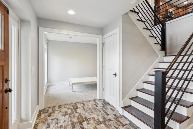 foyer with carpet floors