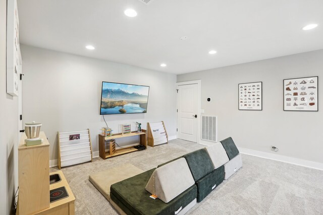 living room featuring light colored carpet