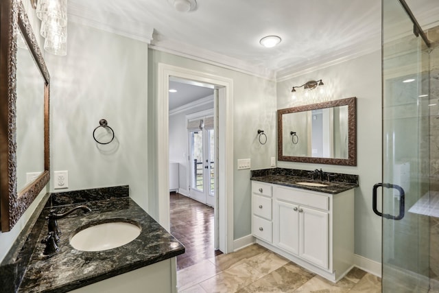 bathroom featuring hardwood / wood-style floors, vanity, crown molding, and walk in shower