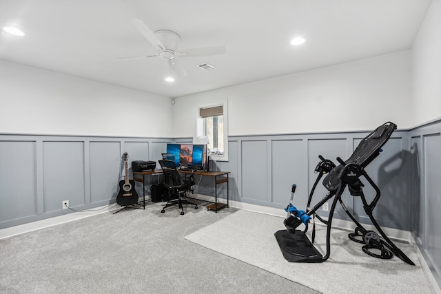 office with light carpet and ceiling fan