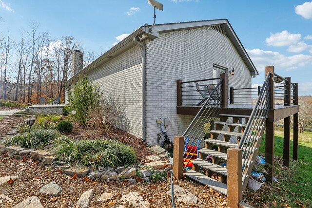 view of property exterior featuring a deck