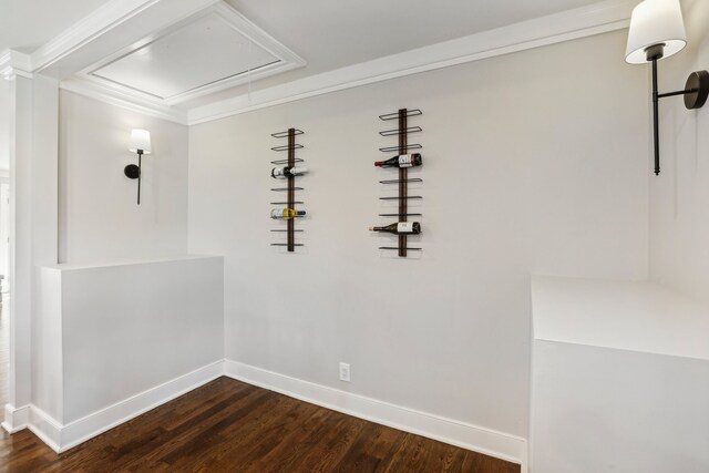 unfurnished dining area featuring dark wood-type flooring and ornamental molding