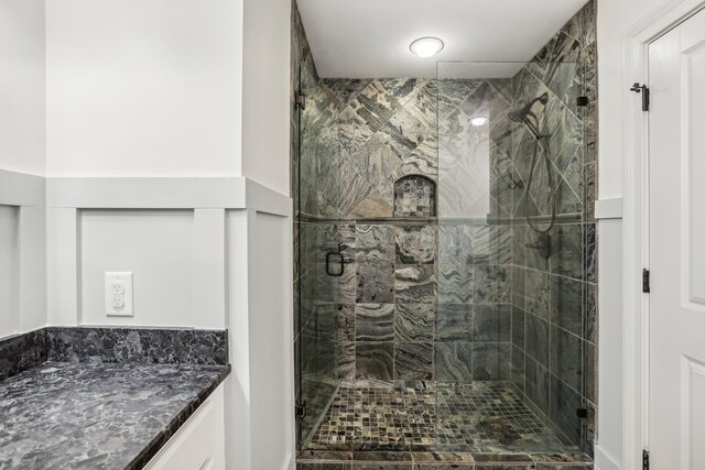 bathroom with vanity and an enclosed shower