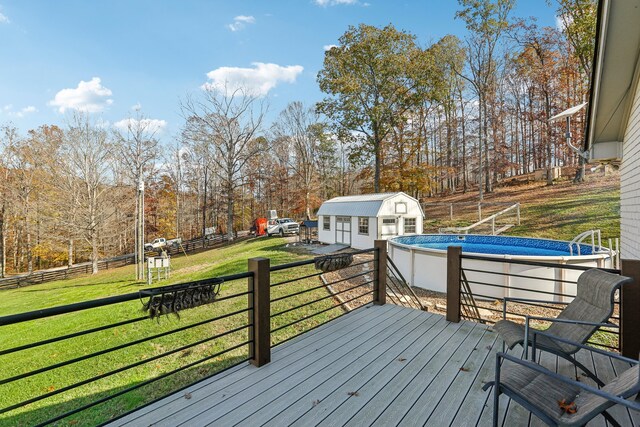 deck with an outbuilding and a yard