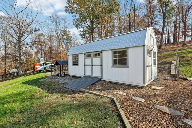 view of outdoor structure with a lawn