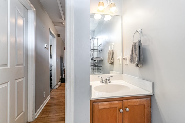 bathroom with vanity and wood finished floors