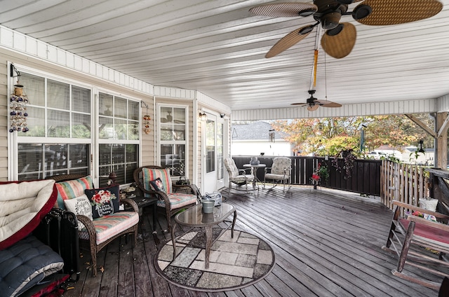 wooden terrace featuring ceiling fan and an outdoor hangout area