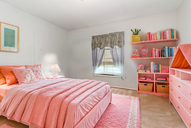 bedroom featuring light carpet