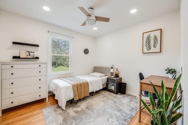 bedroom featuring light wood-type flooring and ceiling fan