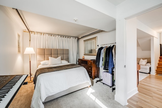 bedroom with a closet and light wood-type flooring