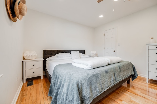 bedroom featuring light wood-type flooring and ceiling fan