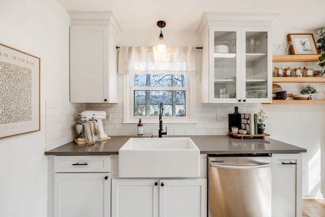 bar with stainless steel dishwasher, wood-type flooring, white cabinets, and sink