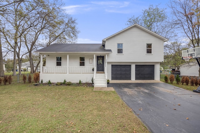 split level home with a garage, a porch, and a front yard