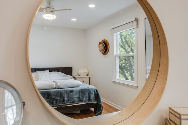 bedroom featuring hardwood / wood-style floors and ceiling fan