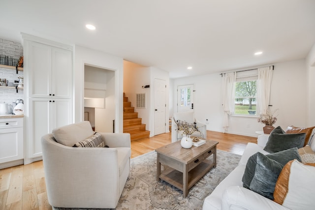 living room with light hardwood / wood-style flooring