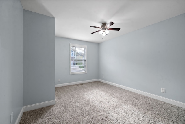 empty room with carpet and ceiling fan