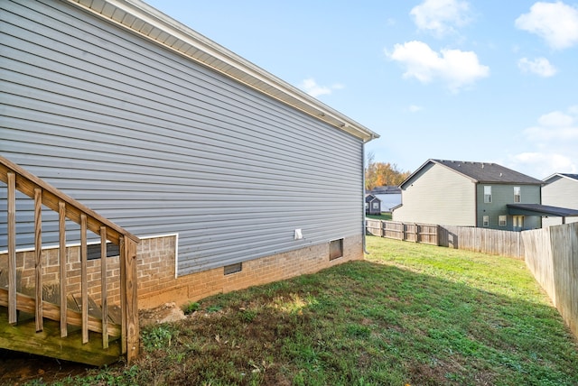 view of property exterior featuring a lawn