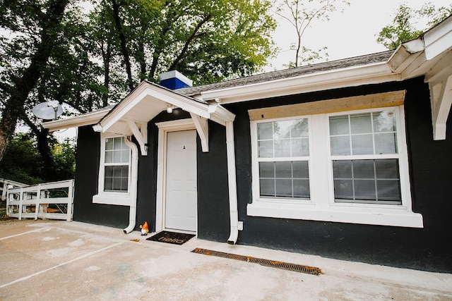 doorway to property featuring a patio area