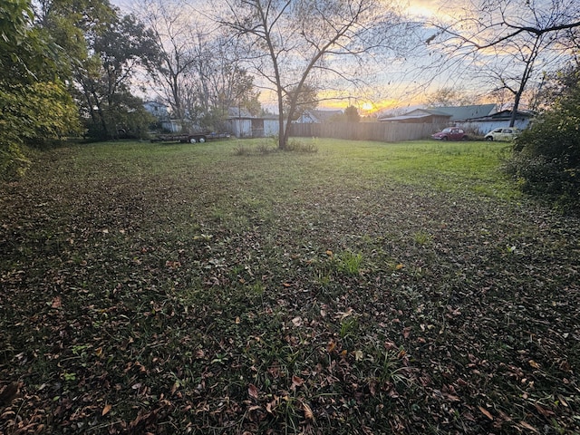 view of yard at dusk