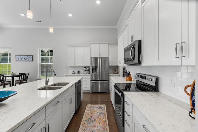 kitchen with white cabinetry, appliances with stainless steel finishes, and sink