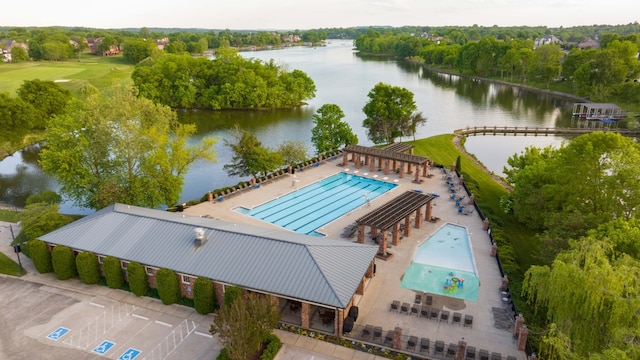 birds eye view of property with a water view