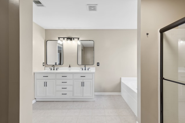 bathroom with vanity, tile patterned floors, and separate shower and tub