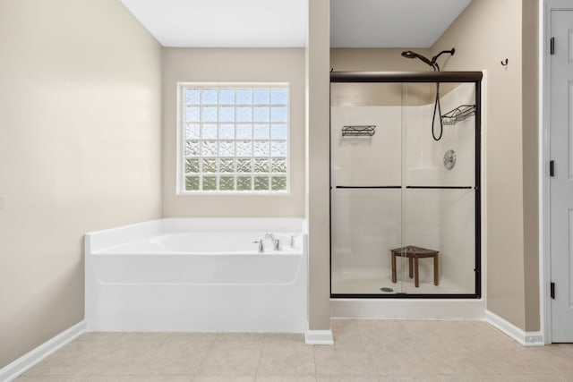 bathroom featuring independent shower and bath and tile patterned flooring