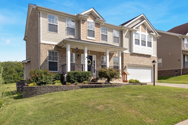 view of front of house with a garage, a porch, cooling unit, and a front lawn