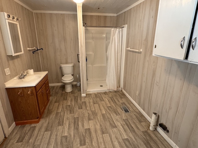 bathroom featuring wood walls, walk in shower, and wood-type flooring