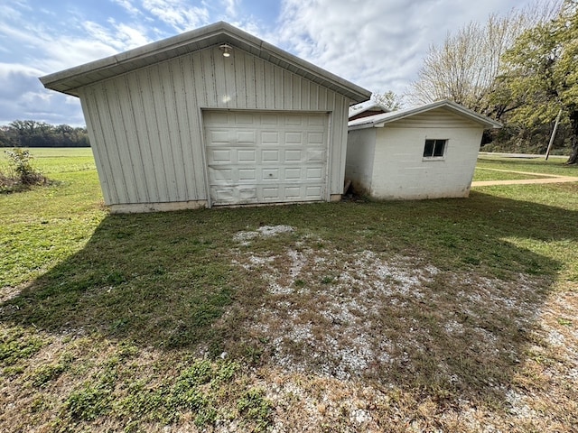 garage featuring a lawn