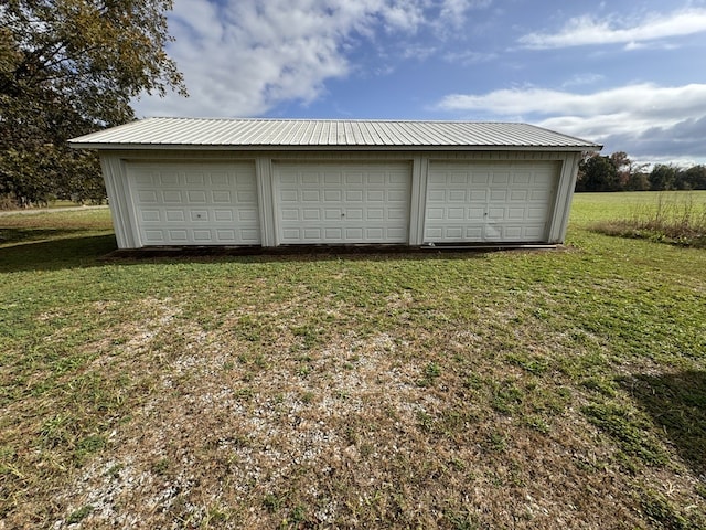 garage with a yard