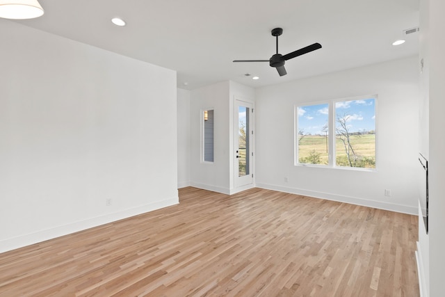 spare room with ceiling fan and light hardwood / wood-style floors