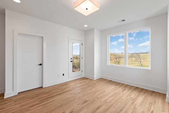 unfurnished room featuring light wood-type flooring