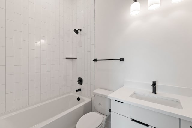 full bathroom featuring vanity, toilet, and tiled shower / bath combo