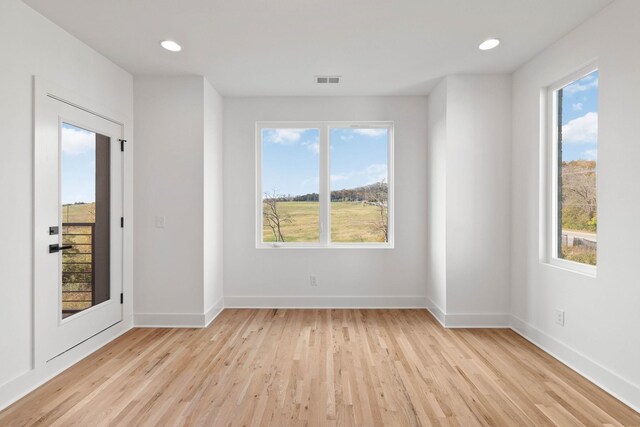 1016 W Trinity Ln Unit 4, Nashville, TN 37218 - unfurnished room with light wood-style flooring and recessed lighting