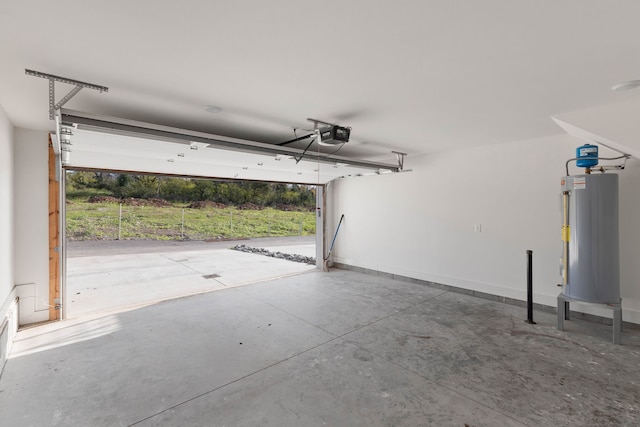 garage with gas water heater and a garage door opener