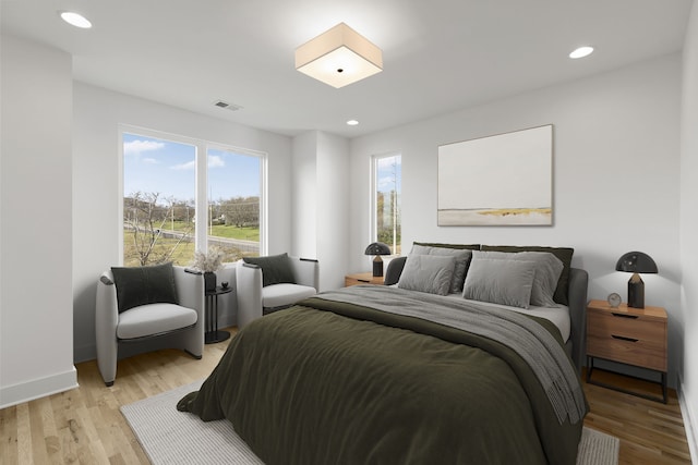 bedroom with light hardwood / wood-style floors